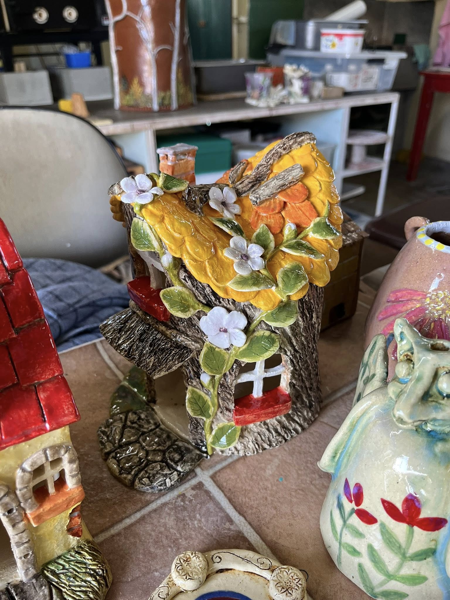 Close-up of a fairy house ceramic piece